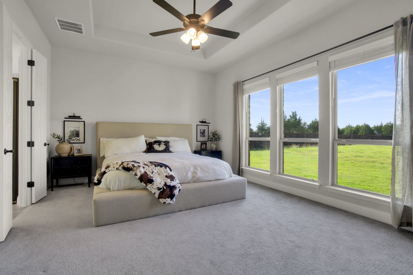 Primary bedroom suite, styled and naturally lit, Ellis County