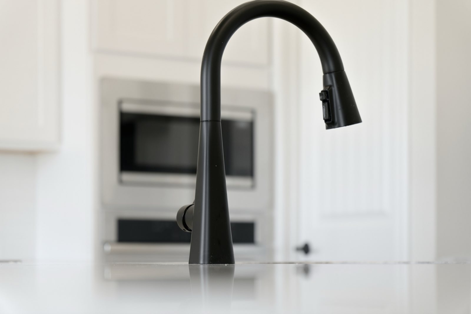 Close detail of a kitchen faucet, Ellis County