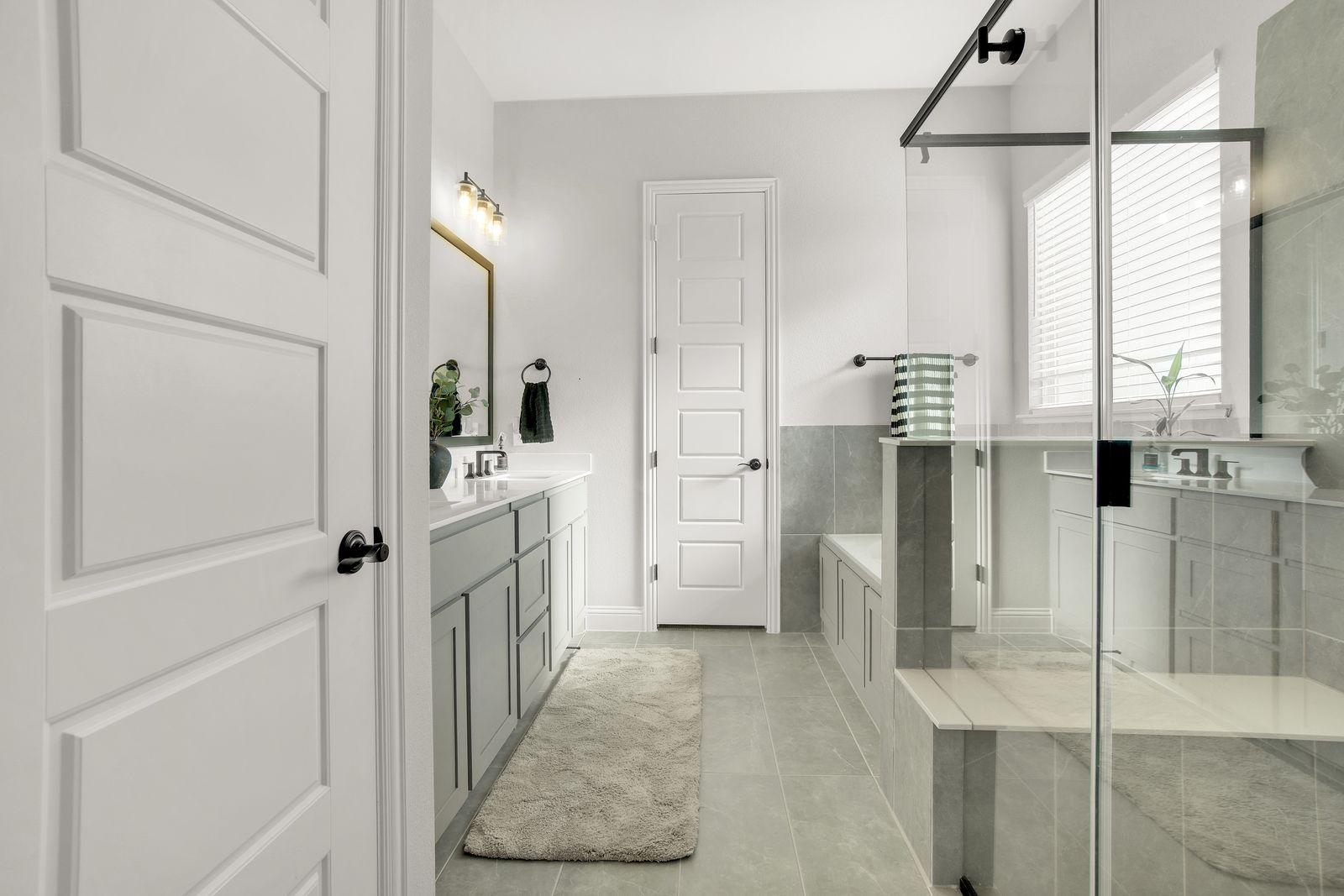 Primary bathroom with clean, bright fixtures